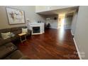 Inviting living room with hardwood floors, fireplace, and comfortable seating at 2150 Winthrop Chase Dr, Charlotte, NC 28212