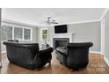 Cozy living room featuring a fireplace, hardwood floors, and comfortable seating at 3127 N Center St, Hickory, NC 28601