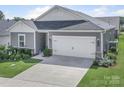 Well-maintained single-Gathering home with lush lawn and two-car garage at 3317 Black Cherry Dr, Monroe, NC 28110