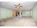 Spacious living room showing the kitchen and rear exit at 38367 Loblolly Ln, New London, NC 28127
