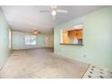 Open-concept living room showcases the pass-through to the kitchen and lots of natural light at 38367 Loblolly Ln, New London, NC 28127