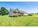 Charming single-story home featuring vinyl siding and a well-manicured lawn at 402 Beaver Dam Church Rd, Shelby, NC 28152