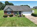 Beautiful single-story home with a well-maintained lawn, landscaping, and a two-car garage at 402 Beaver Dam Church Rd, Shelby, NC 28152