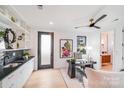 Bright office with custom cabinets, stylish decor, and a modern ceiling fan for a comfortable work space at 414 State St, Charlotte, NC 28208