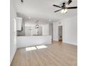 Open-concept kitchen featuring a granite countertop island with pendant lighting and a sink at 455 Contentment Ct # 18, Kannapolis, NC 28081