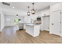 Modern kitchen with white cabinets, a stainless steel dishwasher, and granite countertops at 455 Contentment Ct # 18, Kannapolis, NC 28081