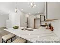 Bright kitchen featuring quartz countertops, stainless steel sink, and modern fixtures, perfect for cooking at 626 Wabash Ave # 6, Charlotte, NC 28208