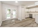 Eat in kitchen area featuring modern floors, French doors, and stainless appliances at 835 Carrington Dr, Charlotte, NC 28214