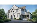 Expansive rear exterior of a white home featuring a covered porch perfect for outdoor dining and relaxation at 914 Edinburgh Ln, Charlotte, NC 28209