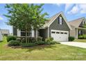Charming home featuring a two-car garage and beautifully landscaped front yard at 10120 Berkeley Castle Dr, Charlotte, NC 28273