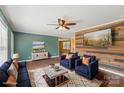 Stylish living room features hardwood floors, modern furniture, and a rustic wood accent wall at 1069 Heather Glen Dr, Catawba, NC 28609