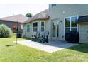 Patio with chairs, lawn, and mature landscaping at 1156 Mckee Farm Ln, Belmont, NC 28012