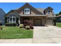 Inviting home with a two car garage and well-maintained landscaping at 1156 Mckee Farm Ln, Belmont, NC 28012