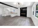 Bright and airy living room with a stylish fireplace and open view to the modern kitchen at 132 Kennedy Ave, Kannapolis, NC 28083
