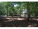 Landscaped home surrounded by mature trees, a long drive, and ample privacy at 1325 Lee Lynn Dr # 7 Part Of 6, Albemarle, NC 28001