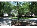 View of home featuring a separate two-car garage on a beautifully landscaped lot at 1325 Lee Lynn Dr # 7 Part Of 6, Albemarle, NC 28001