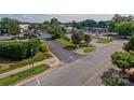 An overhead street-level view shows the parking lot and landscaping at 1410 4Th Street Nw Dr # 303, Hickory, NC 28601