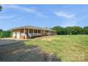 Lovely brick home featuring an attached garage and a spacious front yard at 14411 Eastfield Rd, Huntersville, NC 28078