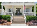 Inviting front porch with comfortable seating and lush greenery at 319 Catawba Ave, Rock Hill, SC 29730