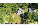 Aerial view showcases the home's private lot, landscaping, and proximity to mature trees and surrounding neighborhood at 408 Camelot Dr, Salisbury, NC 28144