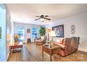 Comfortable living room with hardwood floors, complemented by leather furniture and natural light at 5437 Mallard Ln, Gastonia, NC 28052