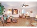 Well-lit living room featuring hardwood floors and stylish, comfortable leather furnishings at 5437 Mallard Ln, Gastonia, NC 28052