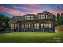 Home's outdoor space provides views for both relaxing and entertaining; manicured lawn at 5985 Natoma Rd, Clover, SC 29710