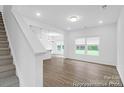 Inviting living room with ample natural light and seamlessly connected to the kitchen and dining area at 614 Wabash Ave # 9, Charlotte, NC 28208