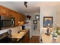Bright kitchen area with stainless steel appliances, ample counter space, and natural lighting at 6148 Meadow Rose Ln, Charlotte, NC 28215