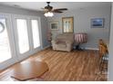 Inviting living room with hardwood floors, neutral walls and bright french doors at 6148 Meadow Rose Ln, Charlotte, NC 28215