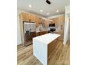 Modern kitchen featuring stainless steel appliances, granite countertops, and custom cabinetry at 101 Bryan St, Kannapolis, NC 28083