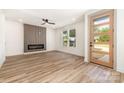 Spacious living room with wood floors, a modern fireplace, and a view to the yard at 101 Bryan St, Kannapolis, NC 28083
