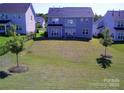 Expansive backyard featuring a well-maintained lawn and a black metal fence at 1141 Overlake Dr, Belmont, NC 28012