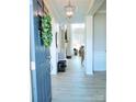 Bright foyer with light wood floors and a pendant light at 1141 Overlake Dr, Belmont, NC 28012
