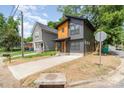 Contemporary home boasting a unique design with contrasting siding and a well-maintained front yard at 177 Georgia Sw St, Concord, NC 28025