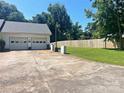 Wide driveway leading to an attached garage with well-maintained grassy areas at 2174 Eastview Rd, Rock Hill, SC 29732
