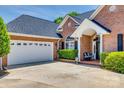 A well-manicured lawn accents this brick home with a two car garage at 2289 Veery Ln, Rock Hill, SC 29732