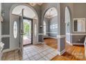 Grand foyer with tiled floor and open archways leading to the dining area, offering an elegant entrance at 2289 Veery Ln, Rock Hill, SC 29732