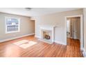 Bright living room featuring a fireplace and hardwood floors at 2405 Greenland Ave, Charlotte, NC 28208