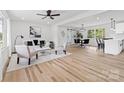 Bright living room featuring hardwood floors, modern furnishings, and an open floor plan at 2610 Fairgreen Dr, Gastonia, NC 28056