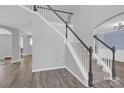 Elegant staircase with wood-look floors, leading to the upper level of the house with natural light at 280 Glenn Allen Rd, Mooresville, NC 28115