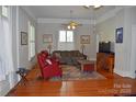 Comfortable living room with hardwood floors, stylish furnishings, and abundant natural light at 318 N Laurel N St, Lincolnton, NC 28092