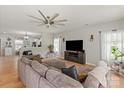 Comfortable living room boasts hardwood floors, a large sectional, and stylish decor at 389 Whispering Hills Dr, Locust, NC 28097