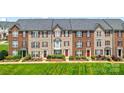 Charming townhomes with landscaped front yards and classic architectural details at 7612 Turley Ridge Ln, Charlotte, NC 28273