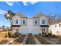 New construction home with a well-manicured lawn and attached garage at 9709 Misenheimer Rd # 4A, Charlotte, NC 28215
