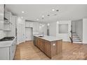 Beautiful kitchen with a large island, stainless steel appliances, pendant lights, and wood flooring at 1006 Kinship Dr # 120, Lancaster, SC 29720