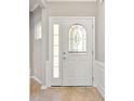 Bright entryway featuring a white door with decorative glass insert and neutral-toned walls at 1031 Fants Grove Ln, Indian Land, SC 29707