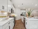 Modern kitchen featuring stainless steel appliances, sleek countertops, and ample cabinet space at 1052 Mapletree Ln, Indian Trail, NC 28079