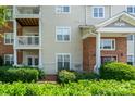 Exterior of condo with balconies and well-manicured landscaping at 10614 Hill Point Ct, Charlotte, NC 28262