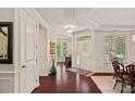 Elegant foyer with hardwood floors, decorative molding, and bright natural light at 1209 Shelly Woods Dr, Indian Land, SC 29707